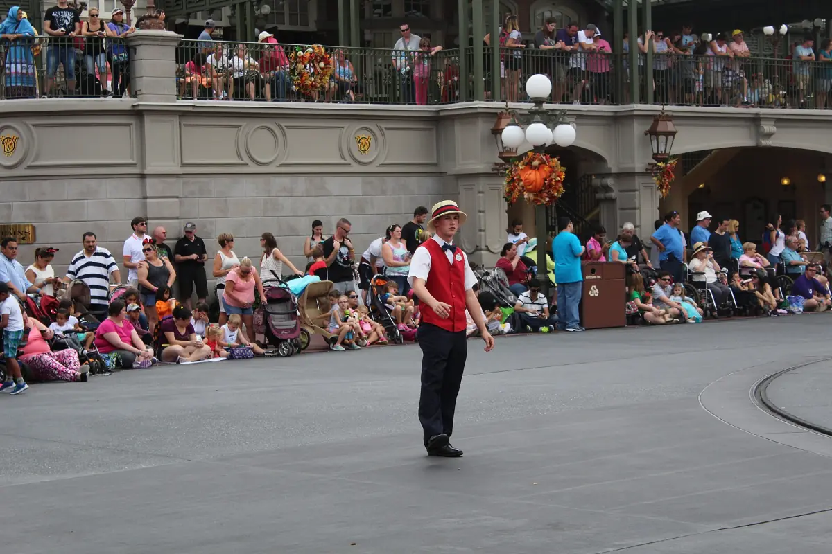 Guests waiting along a parade route at Magic Kingdom